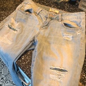 Destroyed denim boot cut jeans